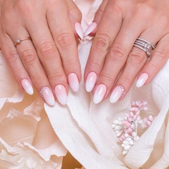 female-hands-with-ombre-manicure-nails-pink-gel-polish